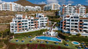 an aerial view of apartment buildings and a swimming pool at Roya Vistamar in Torrox Costa