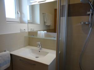 a bathroom with a sink and a shower at Ferienwohnungen Oberbrunnhof in Naturno +28 photos