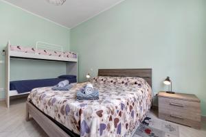 a bedroom with a bed and a bunk bed at Loano Home in Loano