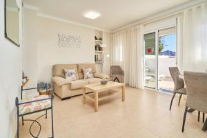 a living room with a couch and a table at Apartamento Fernandita in Nerja