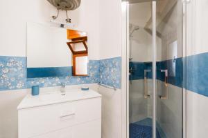 a bathroom with a sink and a shower at Casa Fortuna in Gallipoli +21 photos