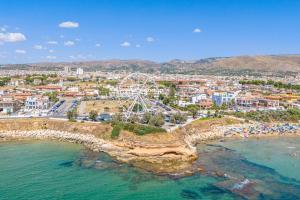 an aerial view of a beach with a ferris wheel at Ciuri Ciuri in Avola