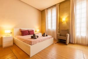 a bedroom with a bed and a chair in it at Sant Pere in Mataró