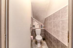 a bathroom with a toilet in a small room at Appartamento In Chalet in Murianette +27 photos