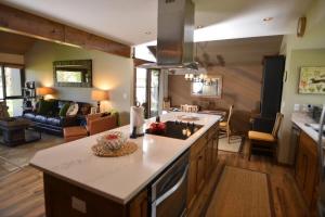 a kitchen and a living room with a counter top at 81 Meadow Lane in Sunriver