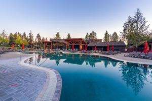 a large swimming pool in front of a resort at 89 Meadow House in Sunriver