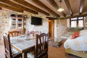 a living room with a table and a couch at Lo paller in Perelló