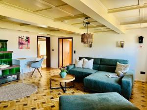 a living room with a couch and a table at Hof Wälderblick in Ibach