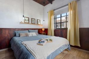 a bedroom with a bed with a tray on it at Finca Viña Maria in Los Realejos +22 photos