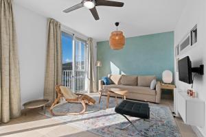 a living room with a couch and a tv at Casa Maria Luisa in Manilva