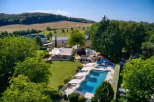 an aerial view of the estate with a swimming pool and a tent at Cabane Spa-Truffiers-Proche Sarlat in Jayac