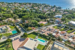 an aerial view of a city with houses and the ocean at Villa Fontane Bianche-Private Pool in Fontane Bianche