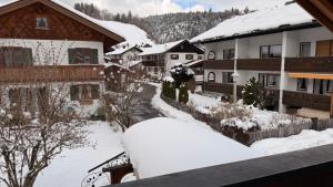 a snow covered town with houses and buildings at Ferienwohnung Wetterstein in Mittenwald