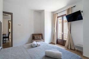 a bedroom with a bed with two towels on it at Il Filo Azzurro Ulassai in Ulassai