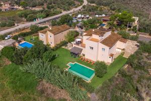 an aerial view of a house with a swimming pool at Villa Paqui in Portopetro