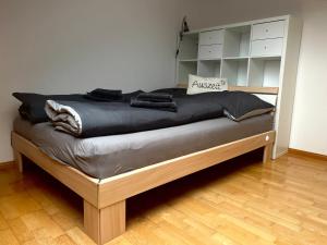 a large bed in a room with at Black Forest Brandenkopfblick in Zell am Harmersbach