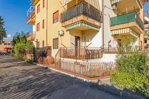 a building with balconies on the side of a street at Da Pina E Lu in Giardini Naxos