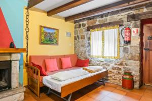 a swing in a room with a fireplace at Lorences A in Caunedo