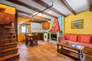 a living room with a couch and a table at Lorences A in Caunedo