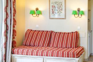a red and white striped couch in a room at Côte Basque in Urrugne +15 photos
