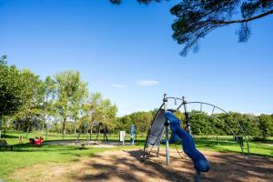 a playground with a slide in a park at Côte Basque in Urrugne