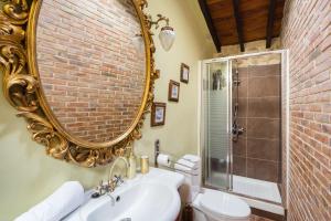 a bathroom with a sink and a mirror at Siglo 16 Denia in Denia +17 photos