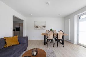 a living room with a couch and a table at Ferienwohnung Emilia in Garding