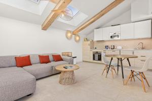 a living room with a couch and a table at La Master Grange De Queyran in La Palud-sur-Verdon