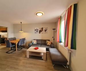 a living room with a couch and a table at Orth A4 in Orth
