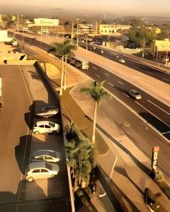 arial view of a city with cars and palm trees at Samba Itaboraí in Itaboraí