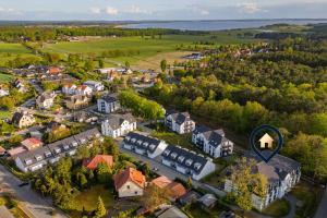 an aerial view of a small town with a building at FeWo Lieblingsort in Loddin