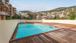 a swimming pool on top of a building at Virginia N 203 ST2 in Grasse