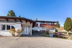 a house with a driveway in front of it at Fidelis-Bühl Muggenbrunn in Todtnau