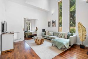 a living room with a couch and a table at Villa Playa Felostal in Palma de Mallorca