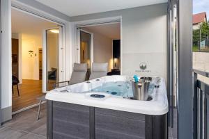 a jacuzzi tub in the middle of a house at Egge Resort 7f mit Whirpool u Sauna in Altenbeken +20 photos