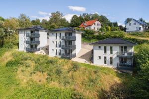 a group of houses on top of a hill at Egge Resort 7f mit Whirpool u Sauna in Altenbeken