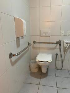a bathroom with a toilet and a shower at Samba Itaboraí in Itaboraí +29 photos