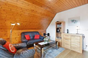 a living room with a couch and a table at Haus Barbara in Bernau im Schwarzwald