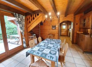 a dining room with a table and chairs at Chalet Du Saix - Sauna in La Chapelle-dʼAbondance