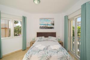 a bedroom with a bed with two pillows on it at Rotonda Spaniahome in L'Alfàs del Pi +29 photos