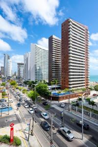 a city with tall buildings and a street with cars at Villa Park Hotel Fortaleza in Fortaleza