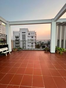 a balcony with a view of the city at Hola Hotel in Can Tho