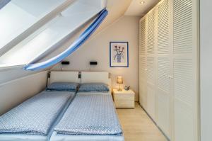 a bedroom with two beds and a slide at Ferienhaus Raschke in Norderney