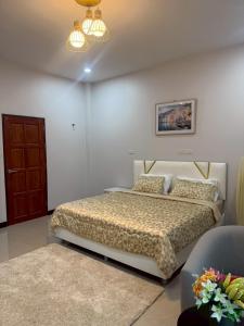 a bedroom with a bed and a couch at Aroyapoolvilla69 in Ban Yep Chaeng +32 photos