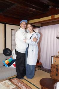 a man and a woman standing next to each other at Yonagoya in Kami