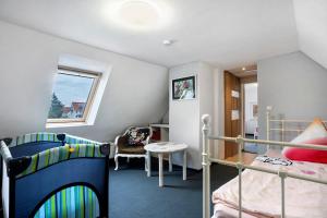 a bedroom with two bunk beds and a desk at Wünsch Dir was in Großweitzschen
