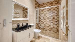 a bathroom with a sink and a toilet at Costacabana - Villa Madison in Lloret de Mar +10 photos