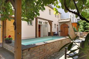 a swimming pool in the backyard of a house at Kurfürstensuite in Brandenburg an der Havel