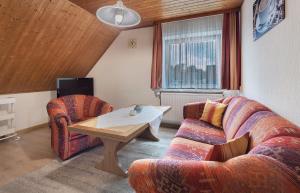 a living room with a couch and a table at Haus Stoldt in Meldorf