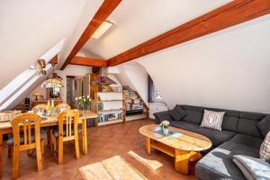 a living room with a couch and a table at Schwarzwaldnest in Bad Wildbad +20 photos